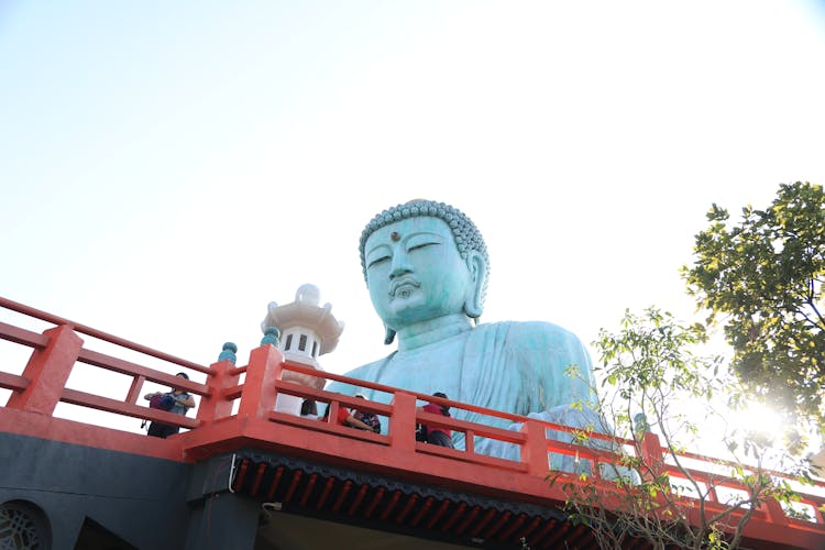 Low Angle Shot Of The Great Buddha Statue In Wat Doi Phra Chan Temple In Mae Tha, Lampang, Thailand 