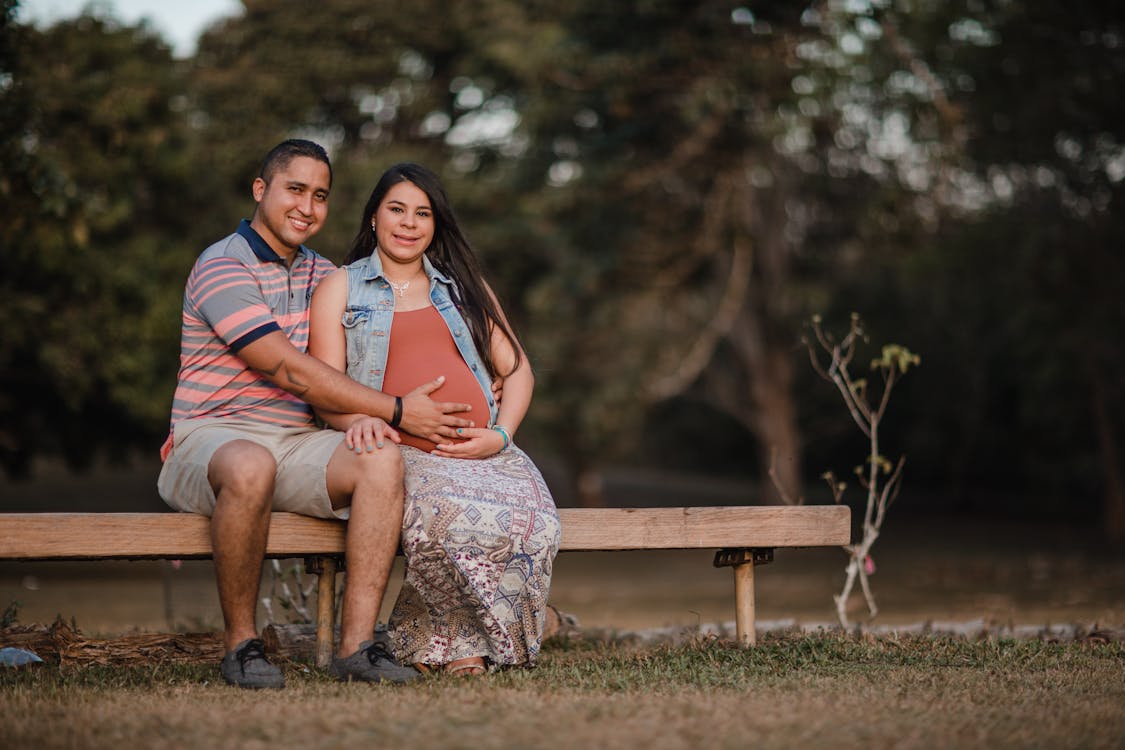 Man and Woman Sitting Beside Each Other