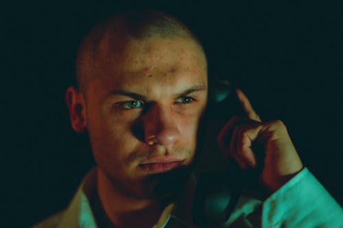 Photograph of a Man Making a Phone Call