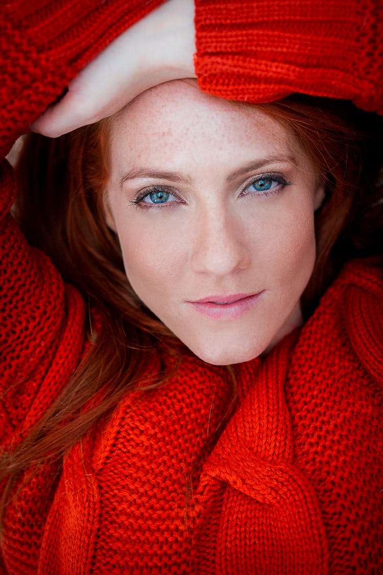 A Woman In Red Knitted Sweater