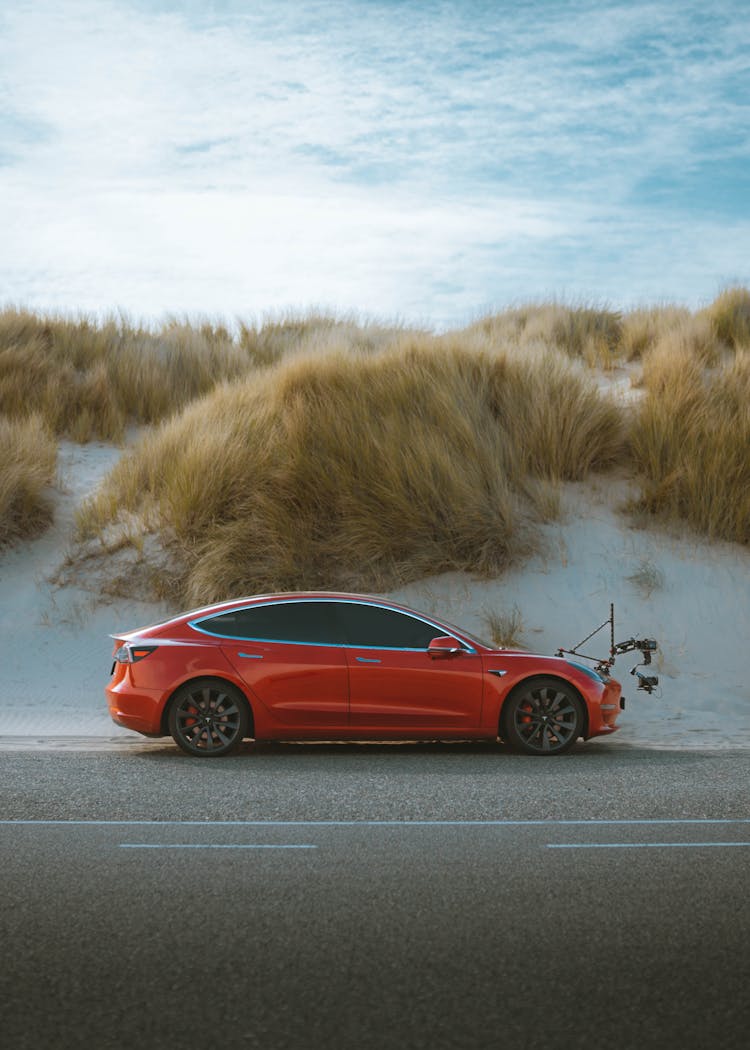 Device On Red Tesla Car