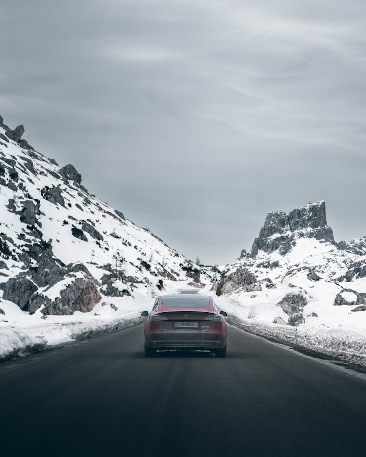 Tesla Car On Gray Asphalt Road