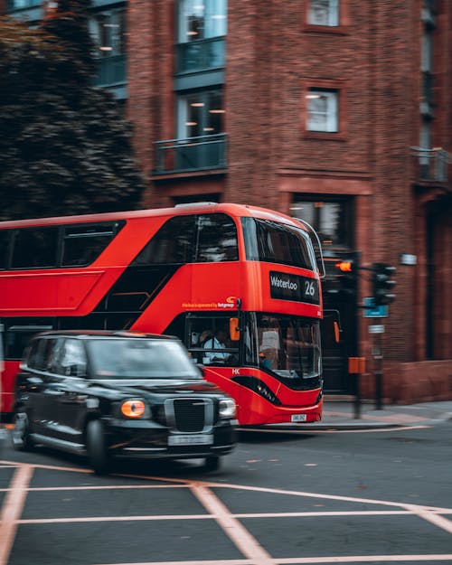 Taxi and Red Double Decker at an Intersection of London