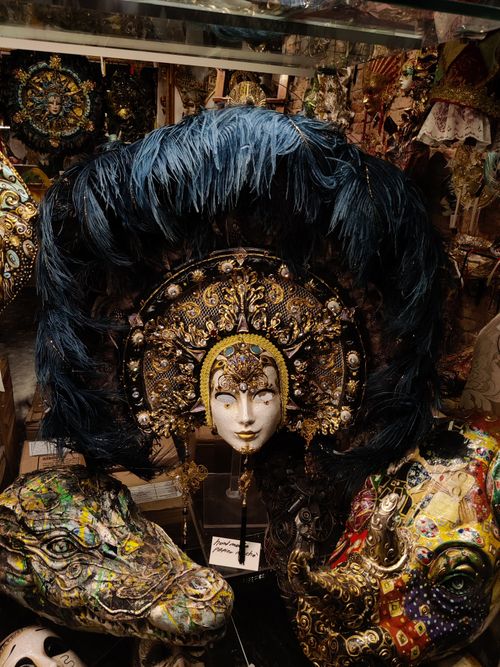 Free Intricately designed Venetian masks showcased in a traditional Venice shop. Stock Photo