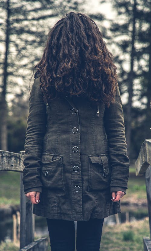 Free Person Standing on Bridge While Looking Down Stock Photo