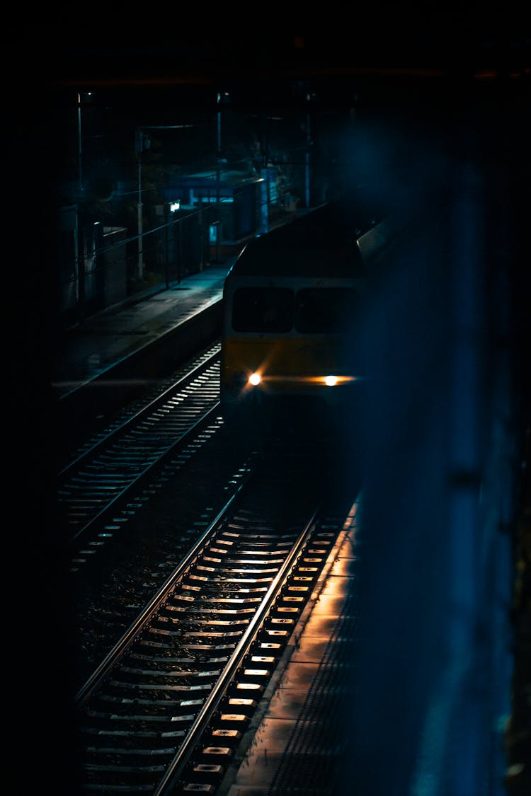 A Train On Railway During Night Time