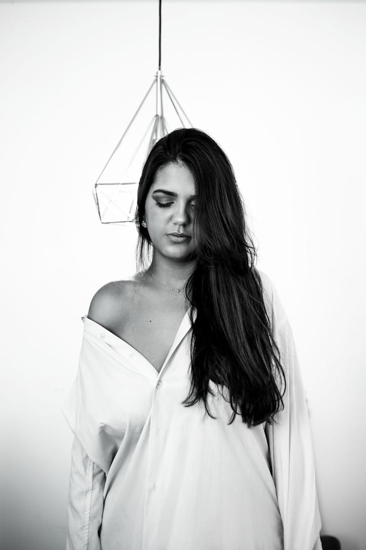 Woman In Shirt Posing On Wall Background