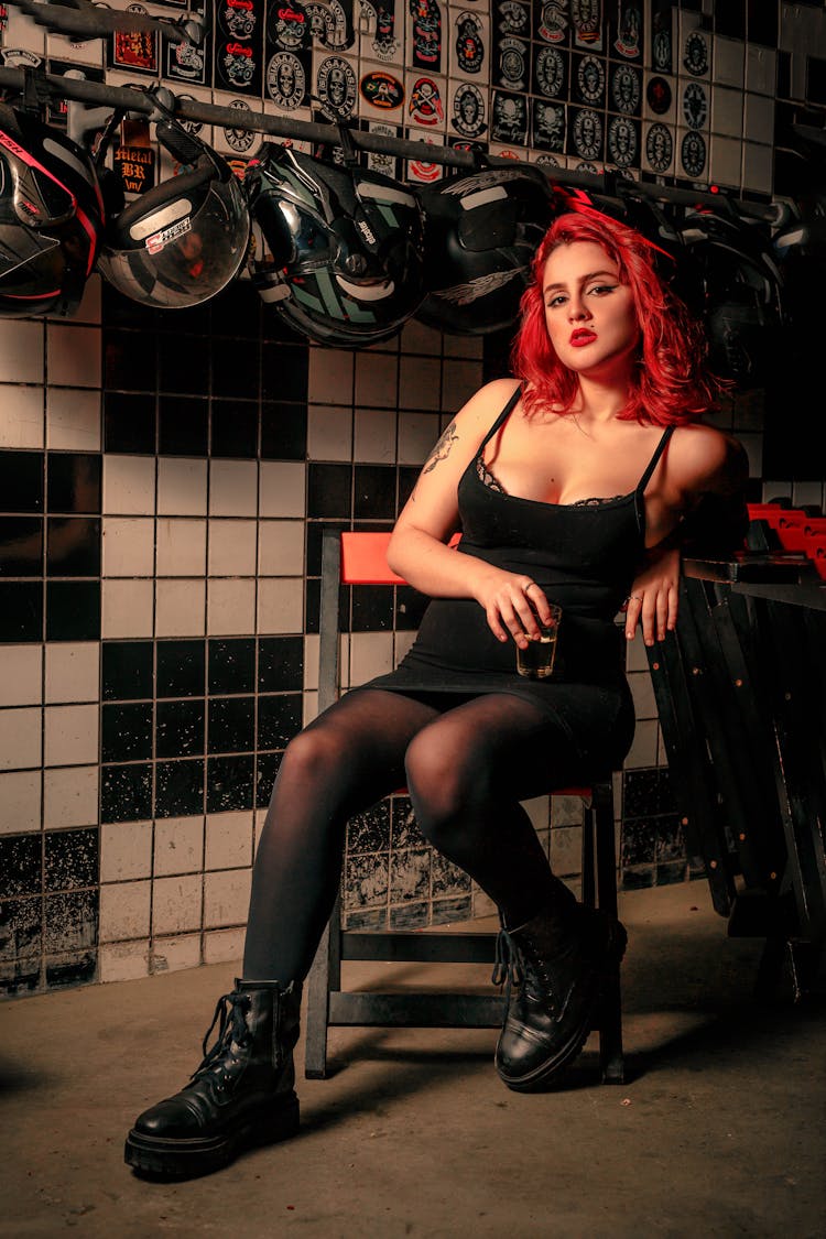 Young Woman With Red Hair Posing On A Chair 