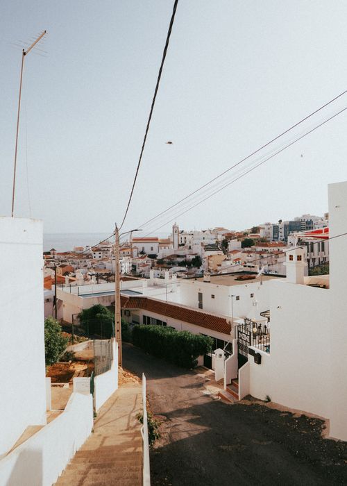 Free Experience the charming white architecture and coastal beauty of Albufeira, Portugal. Stock Photo