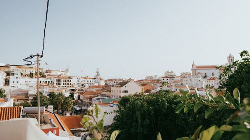 Free Explore the picturesque village of Albufeira, Portugal with its traditional whitewashed buildings and scenic landscape. Stock Photo