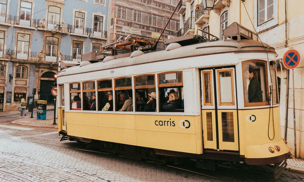 yellow tram lisbon street scene