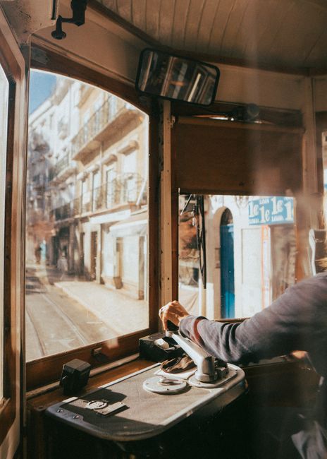 Experience Lisbon's charm through a vintage tram ride, capturing urban life and local architecture.