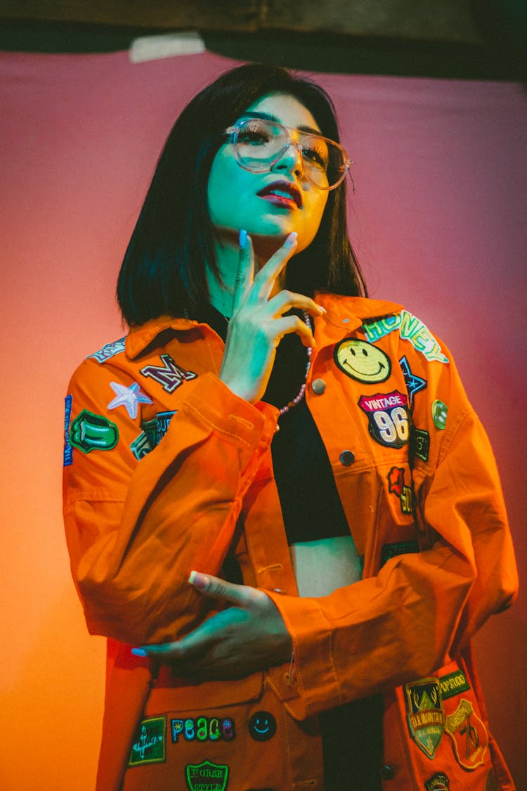 Woman Wearing An Orange Jacket With Patches