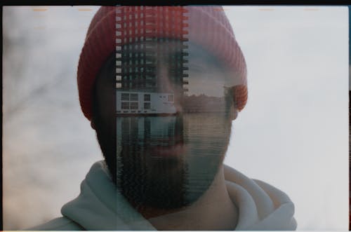 Close-up Photo of Man wearing Red Beanie 