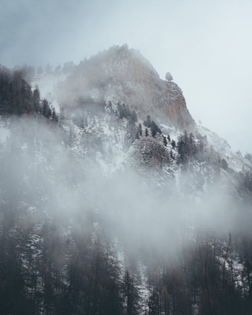 Clouds and Fog over Mountain in Winter