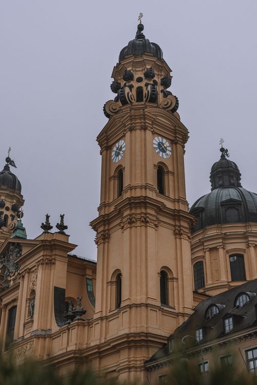 Free Close-up of a baroque church tower in Munich showcasing intricate architectural details. Stock Photo
