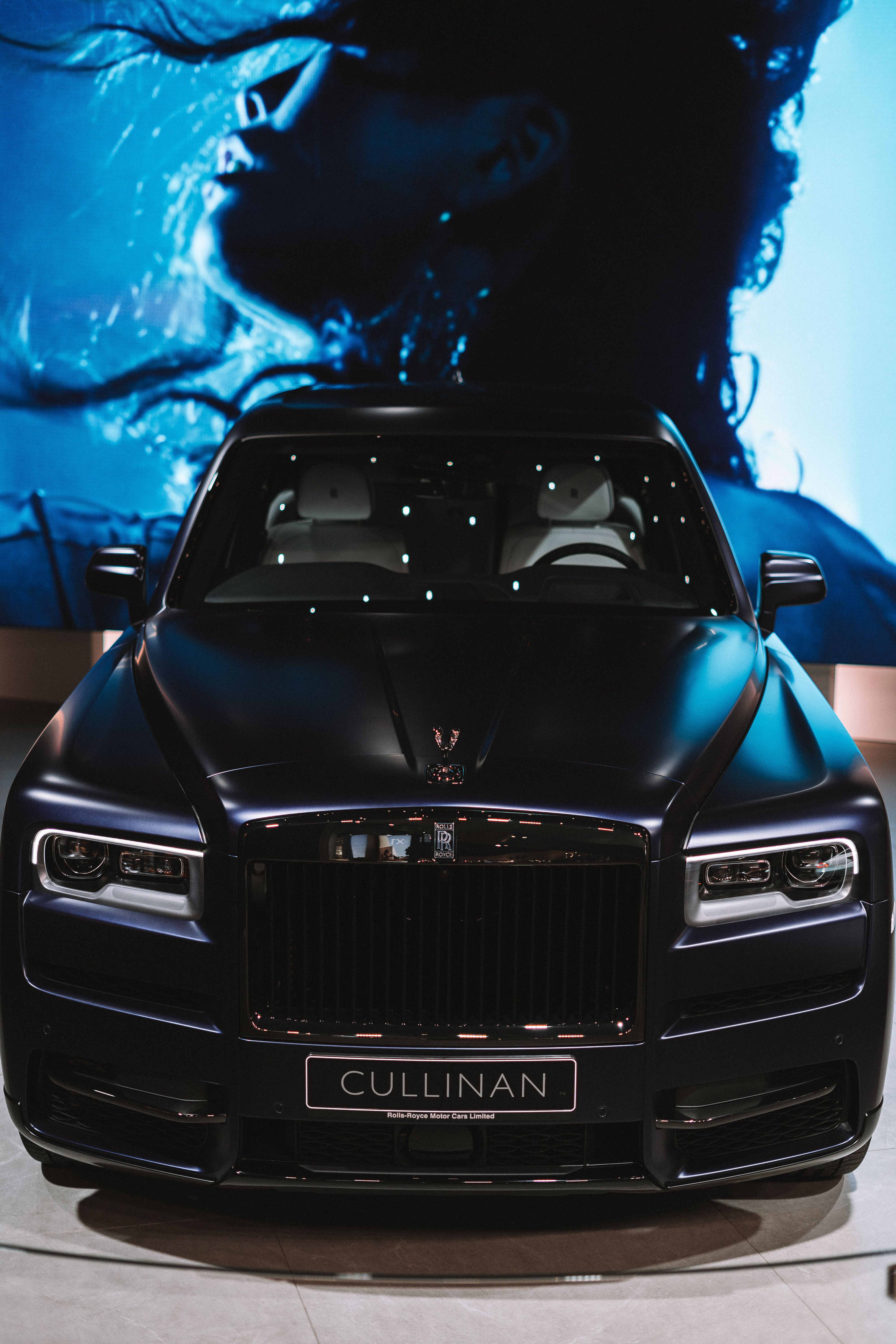 Luxury Black Car Exposed in the Showroom · Free Stock Photo
