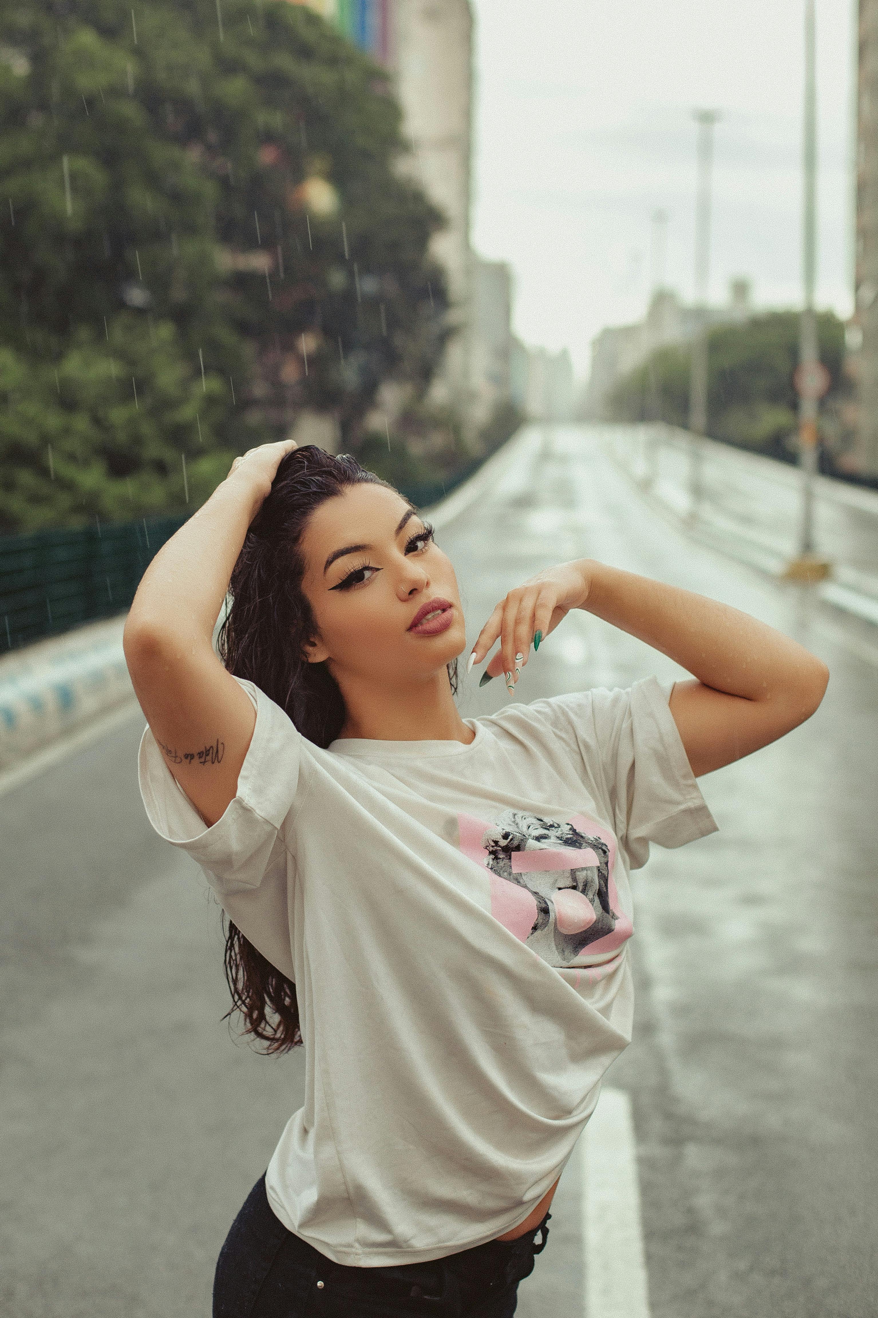 Young Woman in a Football Liverpool FC T-shirt · Free Stock Photo