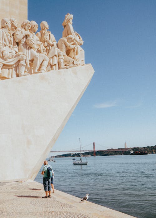 Tourist at the Monument of the Discoveries by the Tagus River in Lisbon