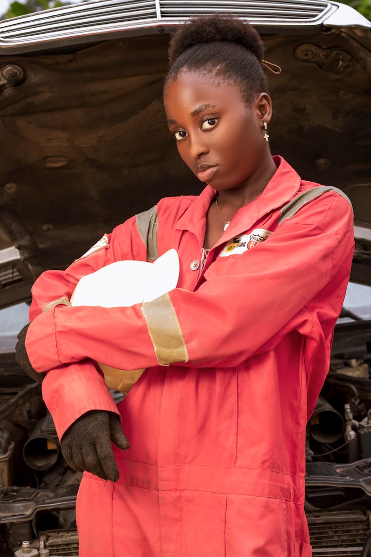 Woman Mechanic In Front Of A Car 