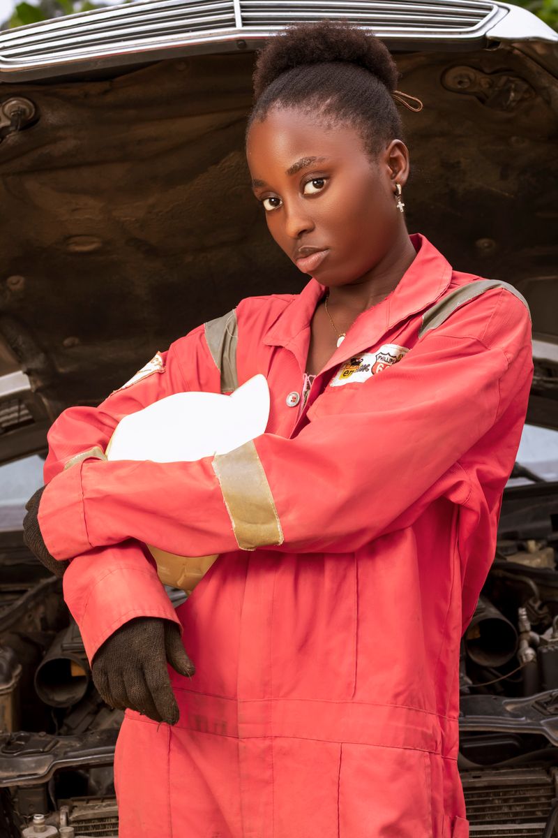 Mechanic working under the hood of a vehicle to diagnose car noises