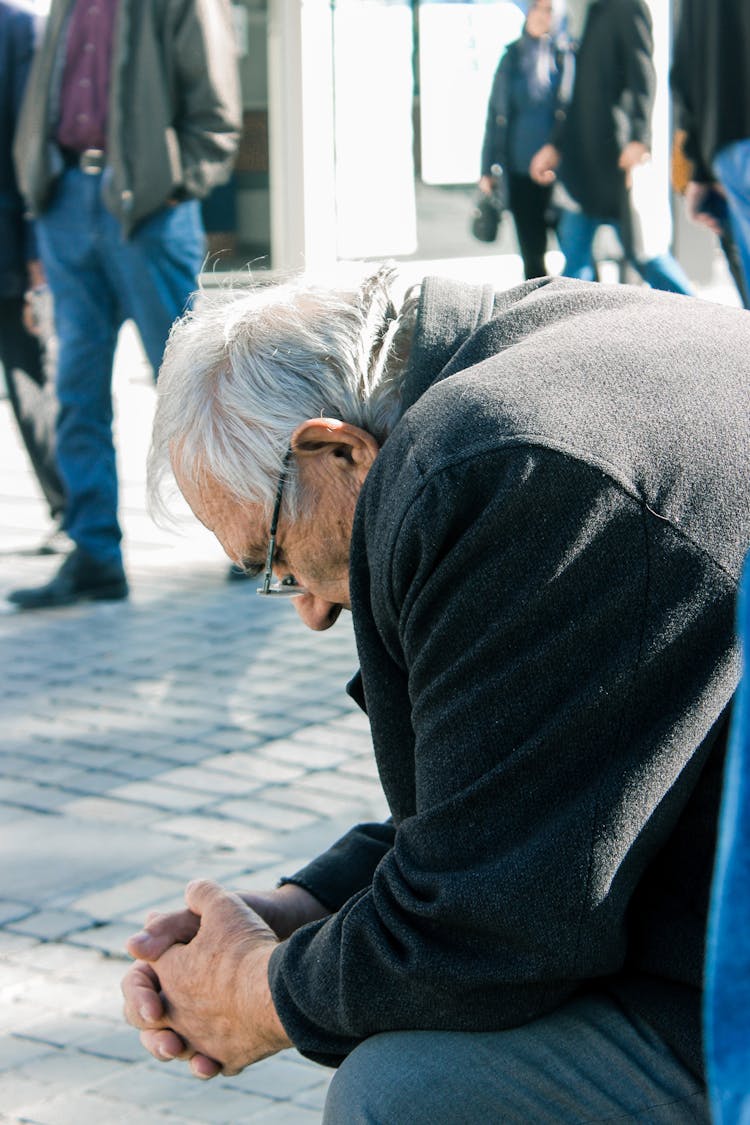 Elderly Man With His Hands Together