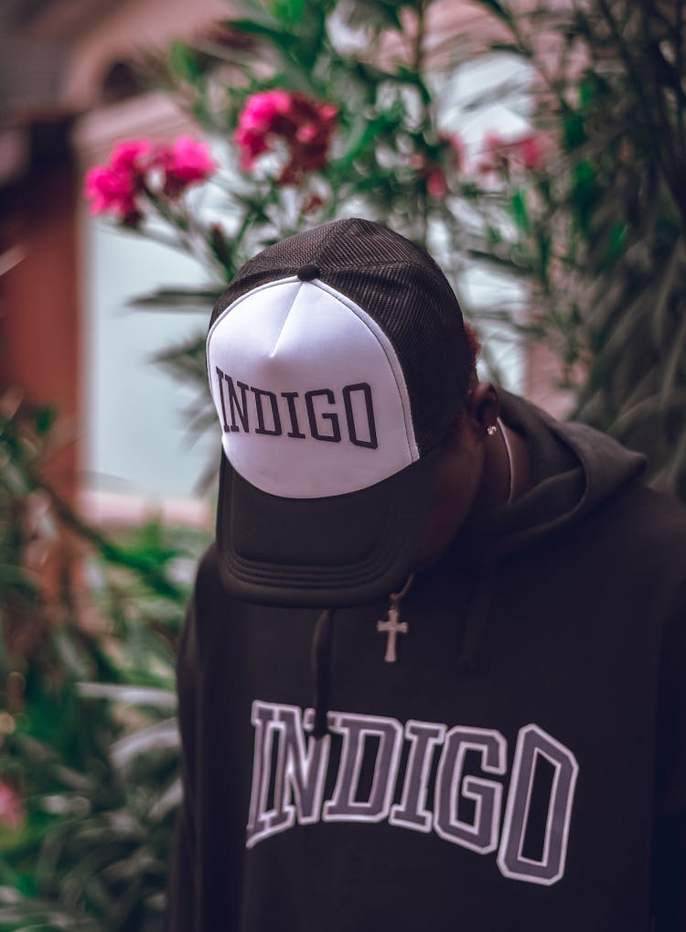 Person In Indigo Brand Hoodie And Cap