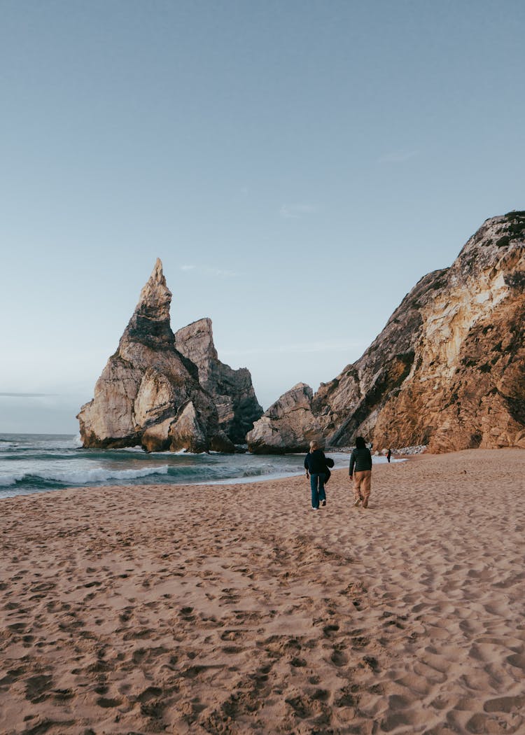 People Walking At The Praia Da Ursa Beach