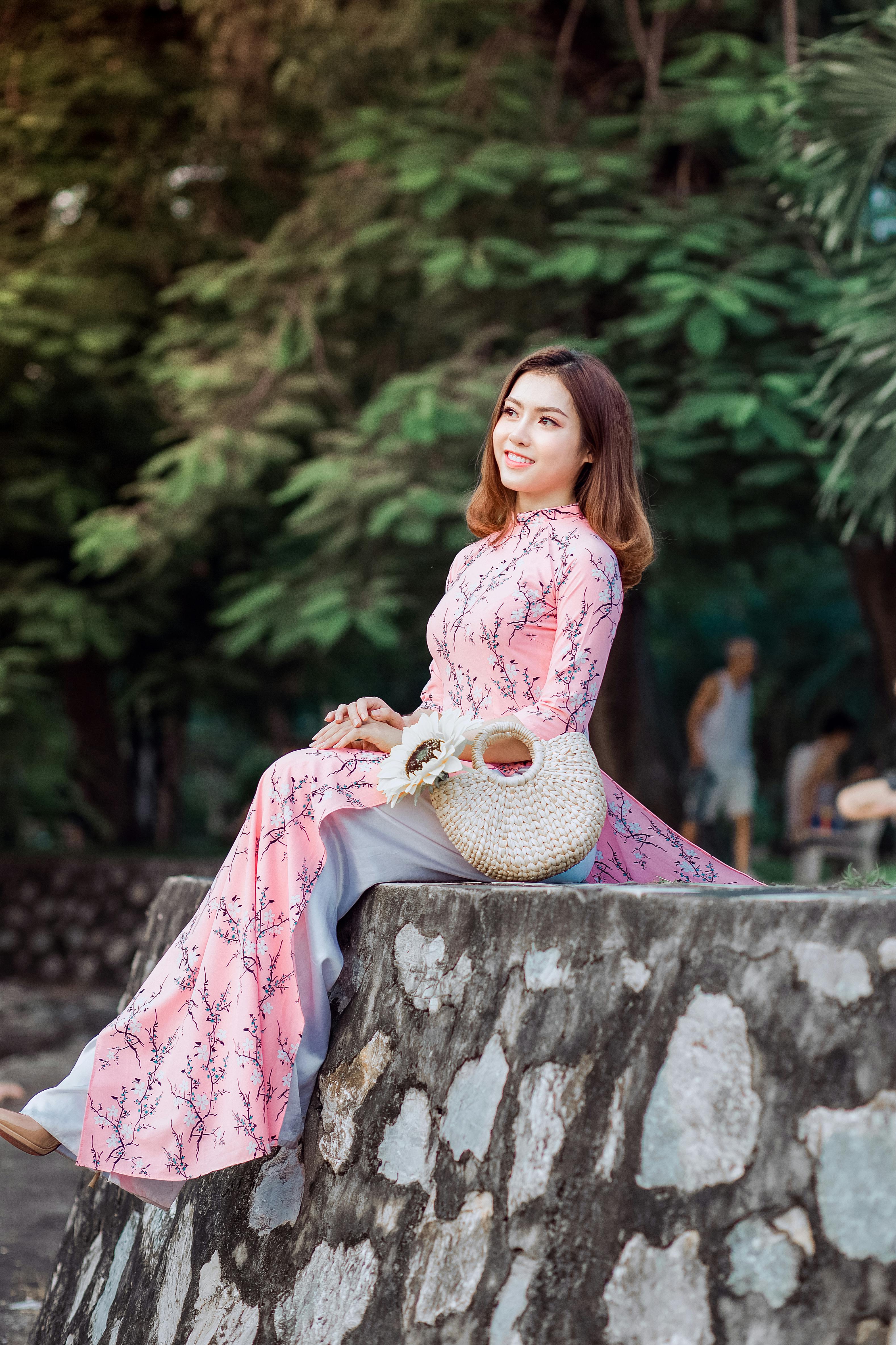 Young stylish brunette girl on shirt, pants, jeans jacket and high heels  shoes, posed background iron fence. Street fashion model concept. 6629543  Stock Photo at Vecteezy