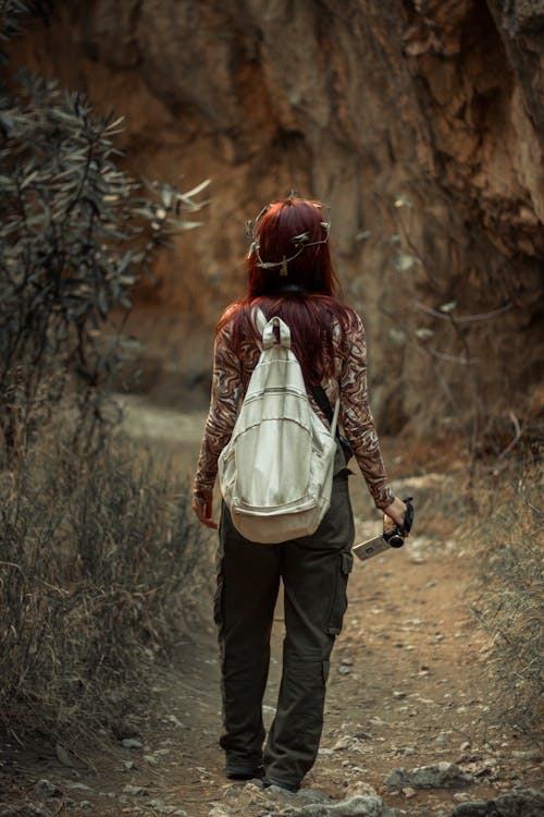 A Woman Carrying White Backpack
