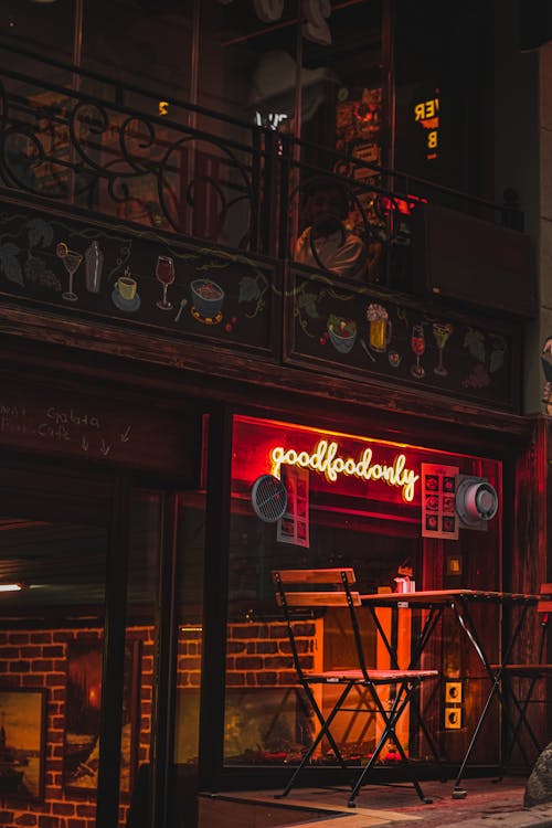 Neon in Front of a Restaurant by the Street at Night 