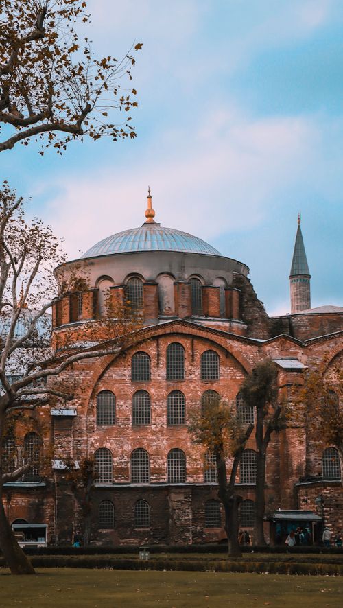 Free Hagia Sophia's iconic dome and Byzantine architecture, captured in Istanbul’s autumn with trees. Stock Photo