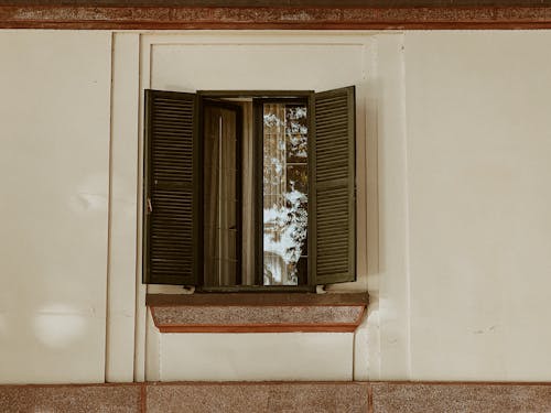 Close-up of a Window with Wooden Shutters 