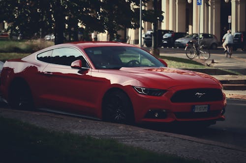 A Red Sports Car Parked on the Street