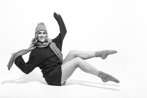 Grayscale Photo of Woman Wearing Beanie and a Scarf