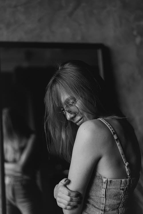 Black and White Portrait of Woman in Denim Overalls