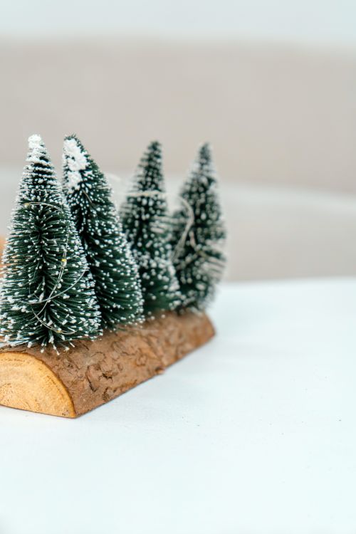 Free Charming handmade Christmas tree decoration on wood, evoking a rustic feel. Stock Photo