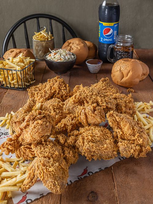 Free Delicious crispy fried chicken served with french fries, buns, coleslaw, and a refreshing drink. Stock Photo