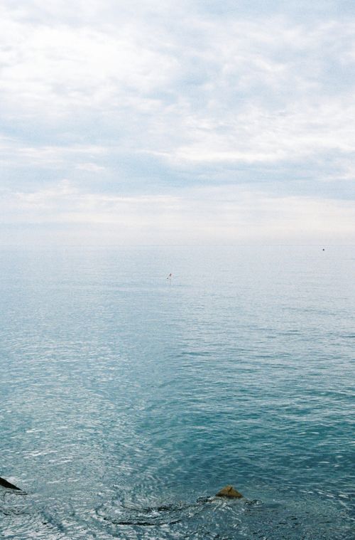 Free Calm and serene view of the ocean under a cloudy sky from the coast of Barcelona, Spain. Stock Photo
