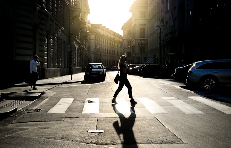 Woman Walking On Pedestrian Lane