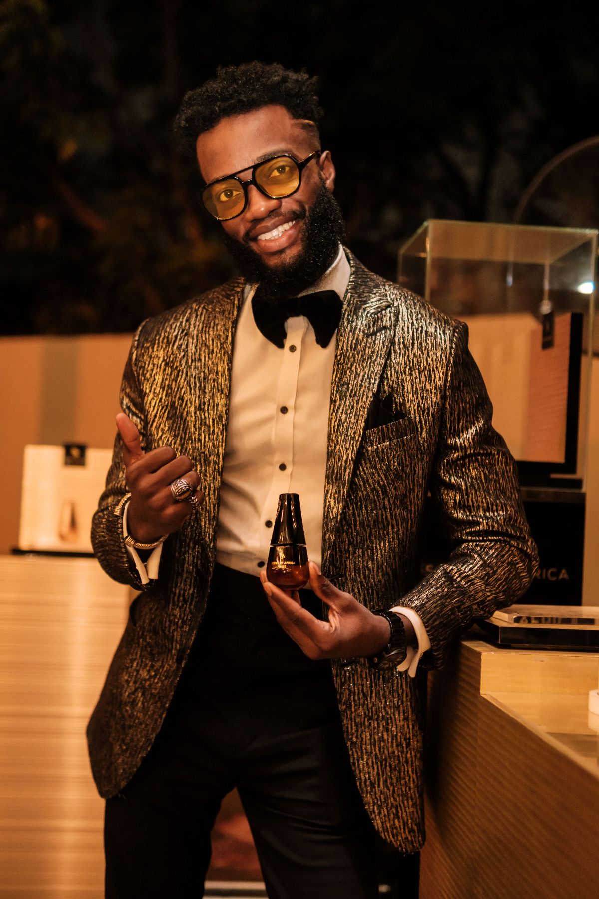Man holding a perfume bottle