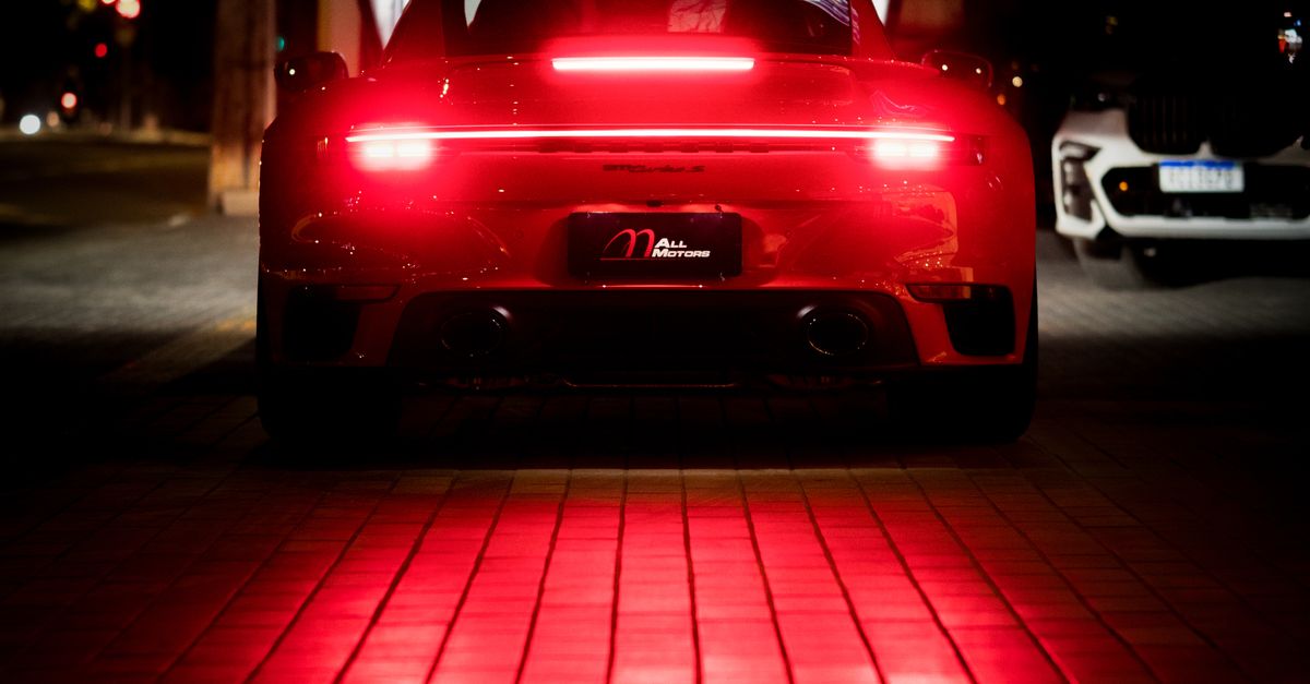 Brightest Rear Light A Car with Red LED Tail Lights on a Brick Floor · Free Stock Photo