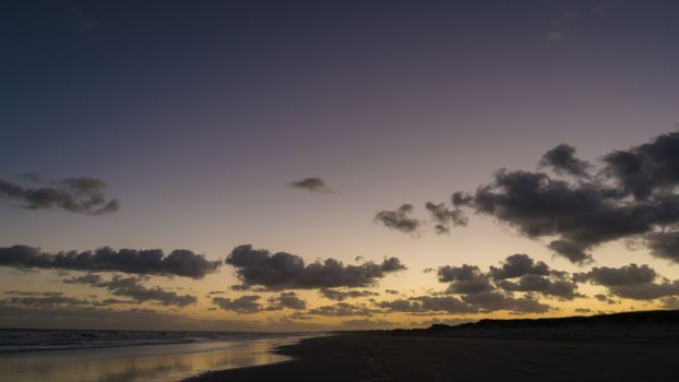 Tranquil twilight view of Barra del Chuy beach's sky and ocean in Uruguay.