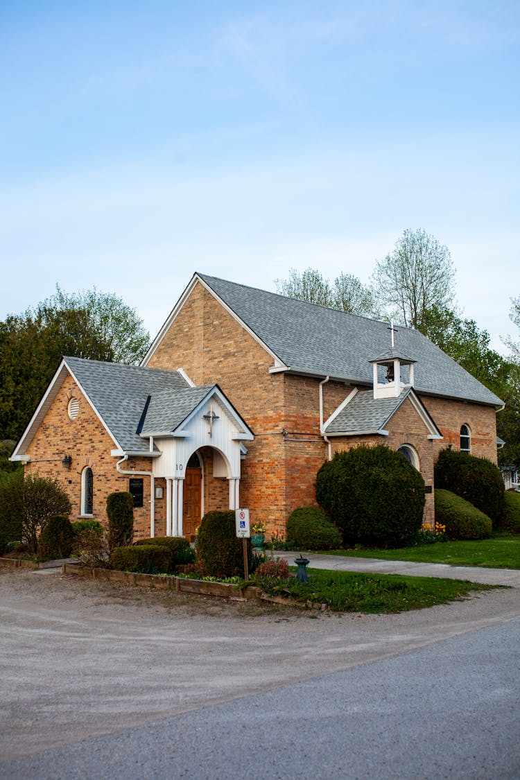 Brick Church Building Under Blue Sky