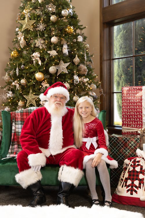 Girl Sitting Beside Santa Claus