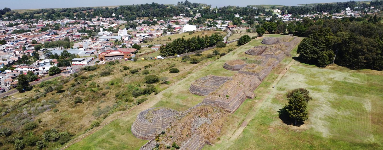 Aerial view of Tancama ruins near Ocampo, showcasing ancient architecture against a vibrant landscape.