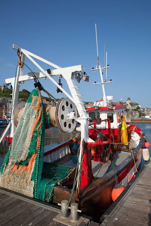 Fishing Boat Beside a Wooden Dock