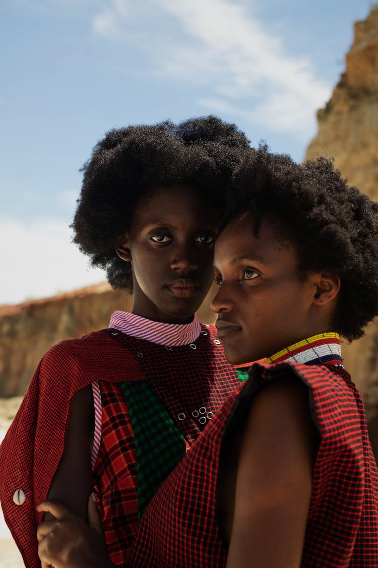 Women Posing Together In Checked Clothes