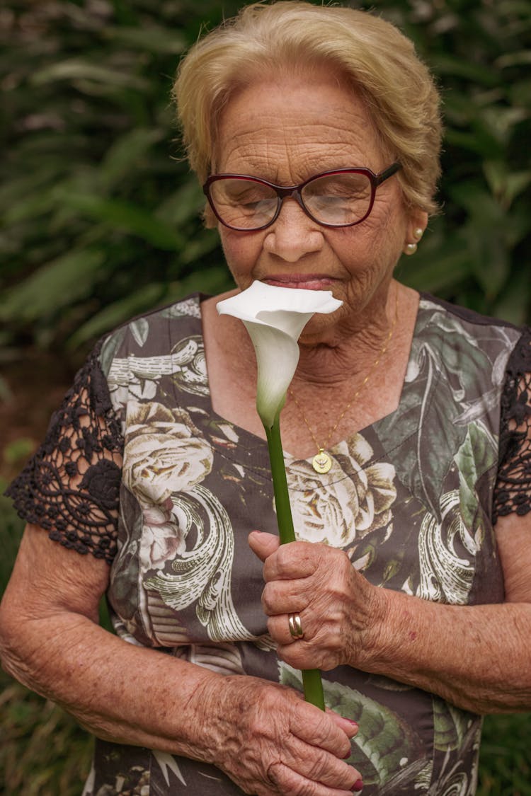 Woman Smelling Flower