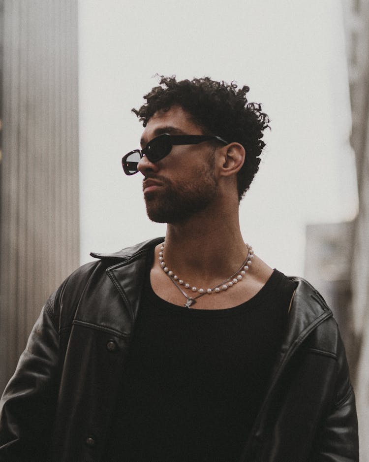 Portrait Of Man In Sunglasses Wearing Leather Jacket